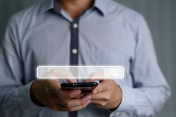 The man is using smartphone to find what he is interesting in the internet. Searching information data on global internet networking concept.Graphic search button design.