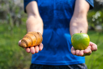Male  making choice between healthy and harmful food .Eating and lifestyle concept. 