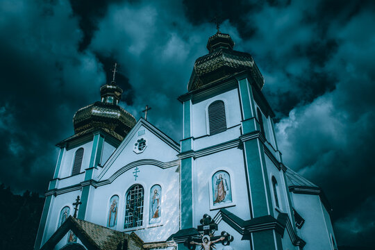 Dome of the church Cathedral of the Descent of the Holy Spirit, travel photo, Ukraine, Rakhiv. Dramatic night cityscape on blue filter