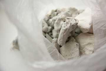 Slices of edible chalk and clay in a plastic bag, sorbents