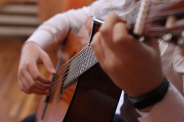 Acoustic guitarist hands