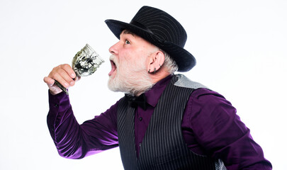 Exotic food. Cocktail with real spiders. Alcohol drink and bar. Bearded old guy hold wineglass with spider inside. Extreme lifestyle. Bartender enjoy weird cocktail. Delicious cocktail for brave man