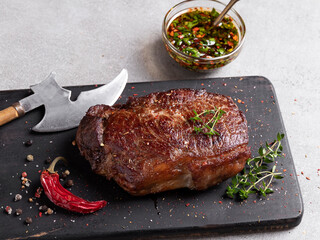 juicy beef steak, mutton roasted on a cutting board,  close up