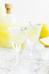 Italian traditional liqueur limoncello with thyme