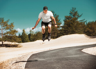 Aggressive inline skating. Young athlete performs tricks during freestyle rolling.