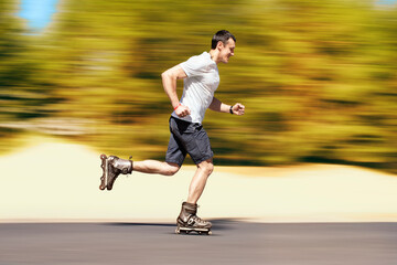 Aggressive inline skating. Young sporty man is rollerblading