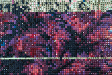 Diamond painting or embroidery pattern. Acrylic rhinestones. Close up, selective focus