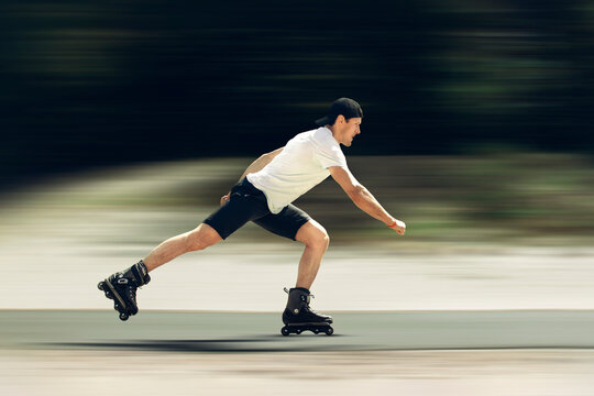 Aggressive inline skating. Young sporty man is rollerblading