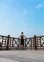 young woman looking at the city