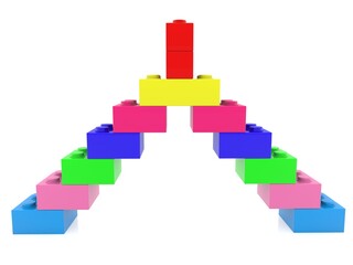 Colored toy bricks are stacked in the form of a pyramid