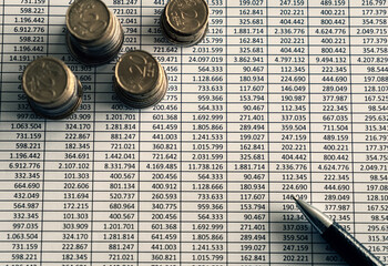 Stack of coins on account book.Business and financial concept.Estimated budget for save money and...