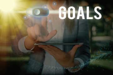 Text sign showing Goals. Business photo text desired result that an individual envision plan and...