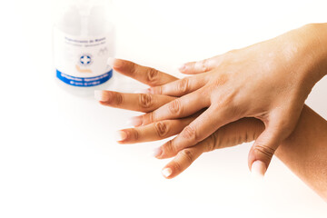 Woman washing her hands with antiseptic gel. Manicured hands