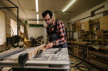 Fototapeta na wymiar Working process in the carpentry workshop