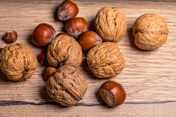 Realistic closeup macro. Hazelnuts and walnuts. Healthy vegetarian food. Natural background.