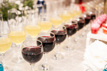 Wedding buffet. Red wine and yellow cocktail
