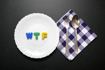 WTF slogan letters on plate with fork and knife.
