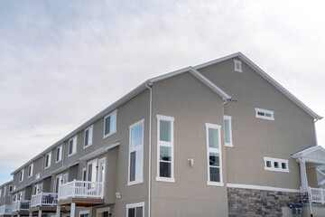 Townhouses exterior with small balconies at the facade in South Jordan Utah