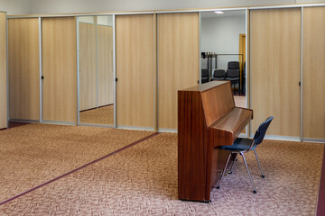 Empty room with lonely piano