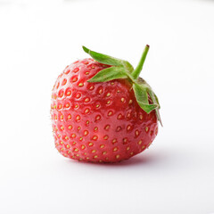 Strawberry fresh vibrant color close up front view arrangement with green leaves isolated on white background studio shot