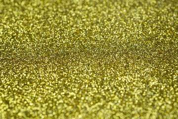 Modern abstract pattern with gold tissue texture on a soft gold background