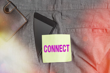Word writing text Connect. Business photo showcasing to join or fasten together usually by something intervening Smartphone device inside trousers front pocket with wallet and note paper