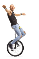 Bald man hipster riding unicycle © Ljupco Smokovski