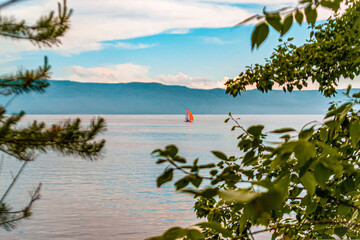A lone sailboat floats on the Volga River