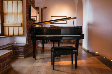 Grand piano in a rustic room