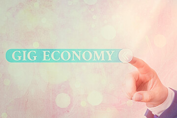 Writing note showing Gig Economy. Business concept for a market system distinguished by shortterm...