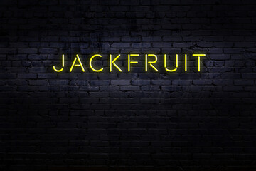 Night view of neon sign on brick wall with inscription jackfruit © iushakovsky