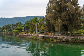 The island Samosir and peninsula Tuktuk Siadong with its resorts, within the Lake Toba, the biggest volcanic lake in the world located in the middle of the northern part of the island of Sumatra 