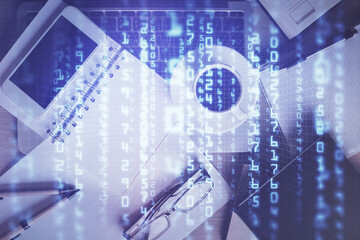 Double exposure of technology theme drawing over work table desktop. Top view. Global data analysis concept.