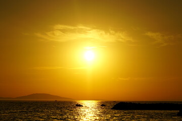 Orange color tone sunset on the sea horizon