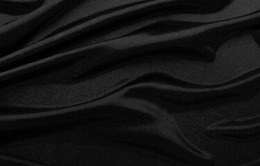 Texture of black fabric in waves.