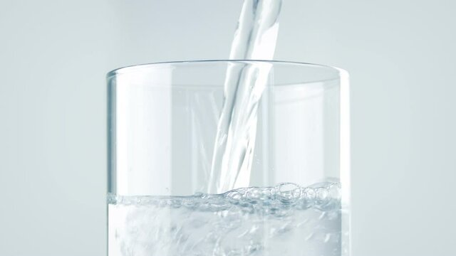 Pure Water Poured Into Glass Closeup