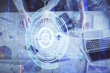 Double exposure of man and woman working together and data theme hologram drawing. Computer background. Top View.