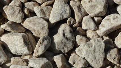 Close up macro of the texture and shapes of stone chips on a gravel path
