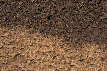 Texture of earth and sand and small stones after rain.