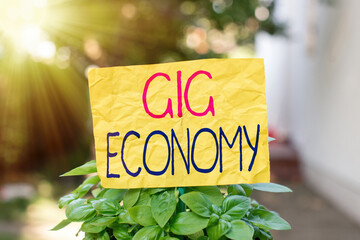 Word writing text Gig Economy. Business photo showcasing a market system distinguished by shortterm...