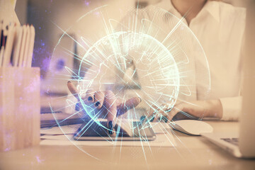 Double exposure of business theme sketch hologram and woman holding and using a mobile device.