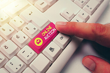 Writing note showing Online Auction. Business concept for digitized sale event which item is sold...
