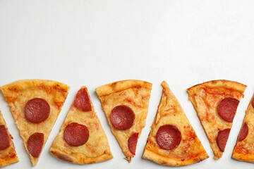 Tasty pepperoni pizza on white table, flat lay. Space for text