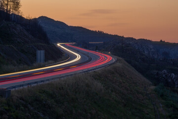 A 25 highway light trails left by cars at sunset , Viseu , Portugal - obrazy, fototapety, plakaty