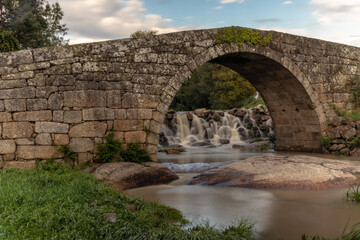 ancient roman bridge over the river Pavia in the city of Viseu, Portugal