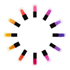 Set of different nail polishes on white background, top view