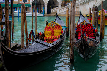 Fototapeta na wymiar Gondolas moored in the Rialto district, Venice, Italy.