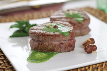 fillet medallion with spinach sauce and Brazil nuts