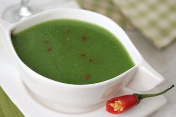 green broth with pepper and herbs
