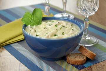 potato soup with shredded chicken and herbs